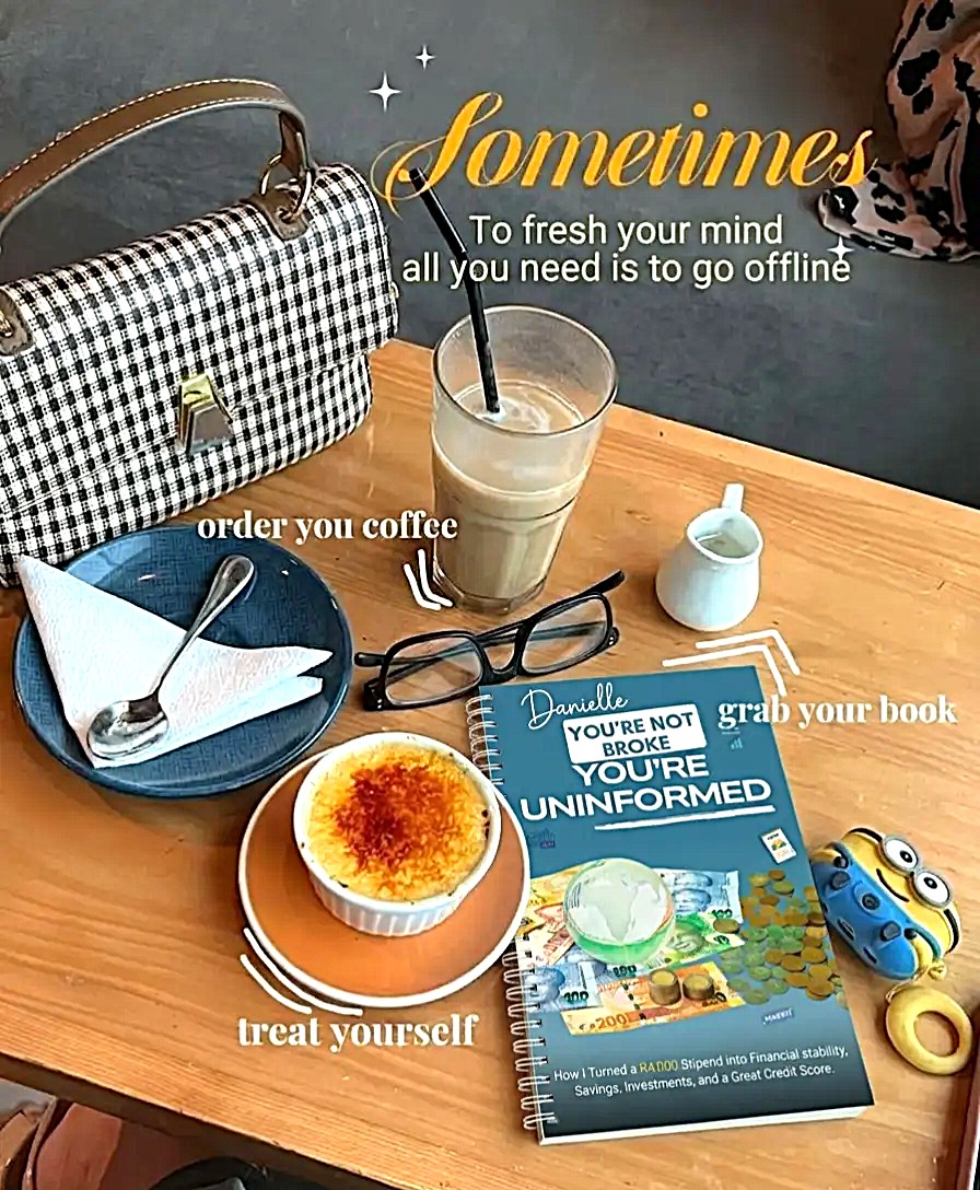 An image of the book: You're Not Broke. You're Uninformed by Author Sakhile Mahlangu on a table with other items.
